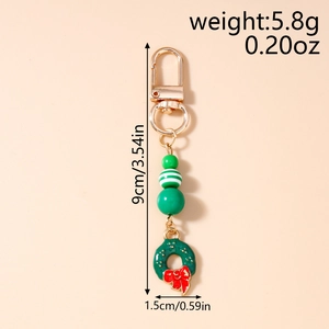 Detailed view of Christmas wreath keychain with green beads and size measurements
