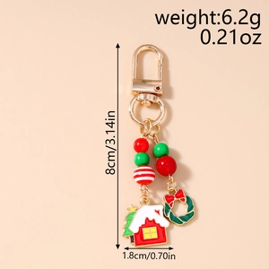Détails du porte-clés de Noël avec dimensions 8 cm par 1,8 cm et breloques festives