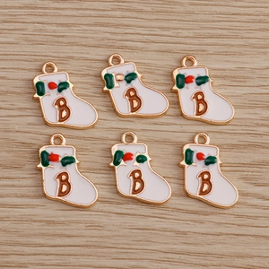 Detail of Christmas stocking charms with letter B for DIY jewelry making sets