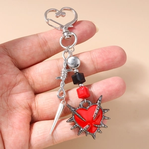 Gothic sword and heart keychain with red heart pendant and silver metallic thorns