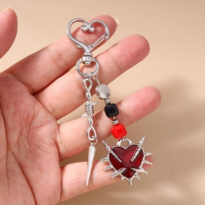 Gothic silver heart carabiner keychain with red enamel thorn heart and metallic spike charms