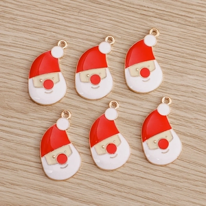 Set of six red and white Santa Claus enamel charms with gold metal edges for DIY jewelry