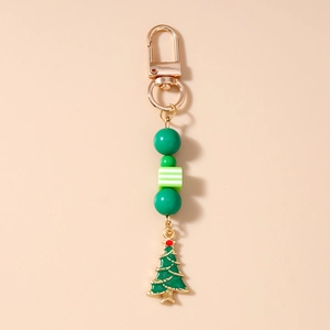 Detail of Christmas beaded keychain with gold Christmas tree pendant and green beads