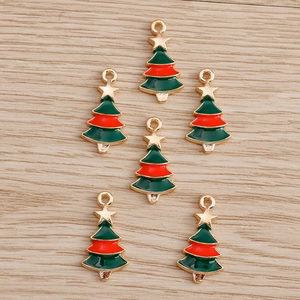 Close-up of golden Christmas tree charms with colorful oil drop finish and star top