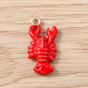 Detailed view of red lobster enamel pendant with gold loop for jewelry making