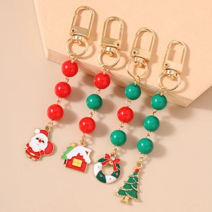Set of 4 Christmas keychains with Santa Claus, snow house, wreath and Xmas tree charms