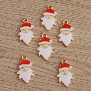 Detailed view of six red and white enamel Santa Claus charms for DIY jewelry making
