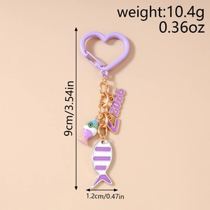 Detail view of purple fish keychain showing exact size measurements and creative alloy design