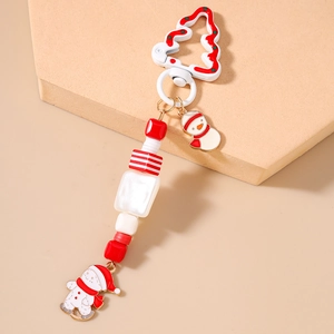 Detailed view of Christmas snowman pearl beaded keychain with white tree carabiner