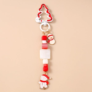 Detailed view of snowman Christmas keychain with red white beads and tree buckle