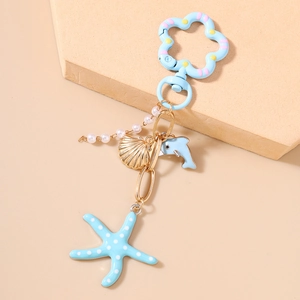 Détails du porte-clés étoile de mer bleue et dauphin avec perles et coquillage doré