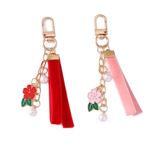 Floral keychain with velvet ribbon and white pearls in pink and red floral design