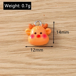Detailed macro view of 14mm orange resin reindeer pendant charms for jewelry making