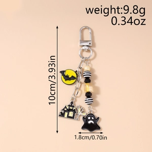 Detail showing Halloween keychain with ghost, bat, and haunted house charms and beads