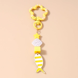 Detail of yellow flower metal clasp and striped fish pendant with multi-bead charm