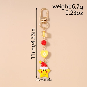 Detail view of a star-shaped Christmas keychain with measurement labels for size and weight