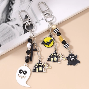 Halloween beaded keychain with ghost, bat, moon and castle charms on a metal hook