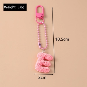 Detailed size view of pink rose letter E keychain with lobster clasp and bead chain