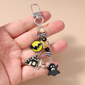 Detail of Halloween beaded keychain with bat moon, haunted house and ghost enamel charms