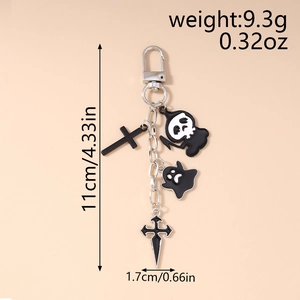 Detail view of silver Halloween keychain with dimensions 11cm by 1.7cm and ghost charm