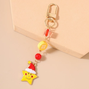 Close-up of a festive star keychain with a red Santa hat and colorful decorative beads
