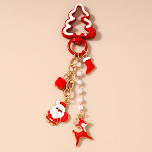 Detail of Christmas keychain with red stocking and Santa charms on pearl bead chain