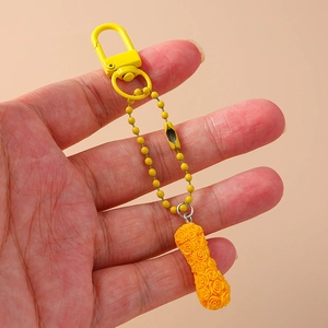 Yellow rose textured keychain with cylinder pendant and D-ring clip for bags