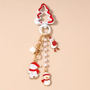 Detail of Christmas snowman keychain with white tree clasp and enamel charms on gold chain