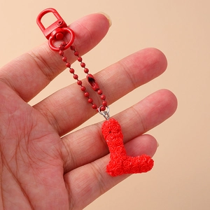 Detail of red floral alphabet letter L keychain with roses and metal lobster clasp