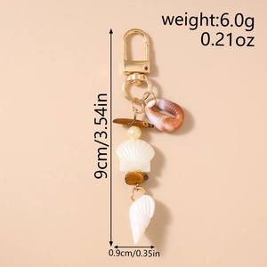 Detailed view of ocean style keychain with shells and pearls showing 9cm total length