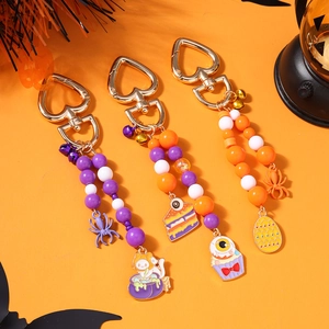 Halloween-Perlenanhänger mit Spinne, Hexenkatze und Kuchendesign auf orangefarben in Orange