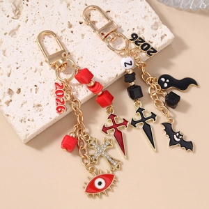 Gothic Halloween beaded keychains with evil eye, cross, ghost, and bat charms in 2026 style