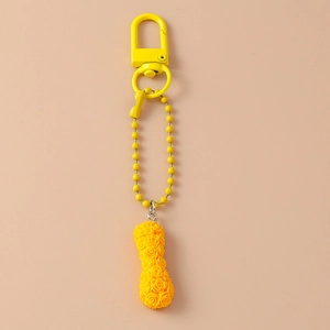 Macro view of bright yellow floral peanut pendant with a metallic lobster clasp