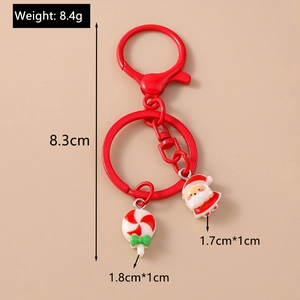 Detailed view of Christmas keychain with Santa Claus and red lollipop charms showing sizes