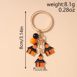 Detail view of Halloween keychain with castle charms and dimensions in centimeters