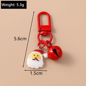 Detail of Christmas Santa keychain with red lobster clasp, rubber head and metal bell