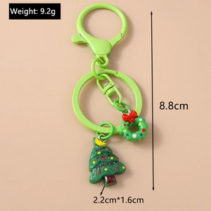 Detail of Christmas tree and wreath keychain charms with measurements and green finish