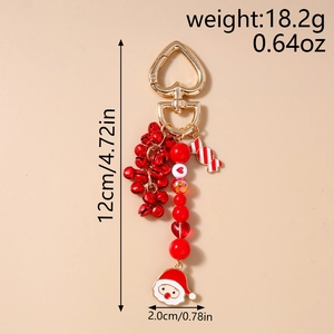 Christmas keychain with red bells, candy pendant and Santa Claus charm details