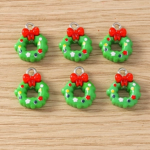 Detailed macro view of 6-piece Christmas wreath charms with red bows and silver metal rings