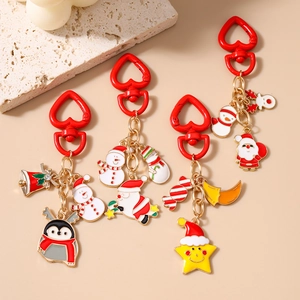 Weihnachts Schlüsselanhänger Set mit Weihnachtsmann und Schneemann auf rotem Karabiner