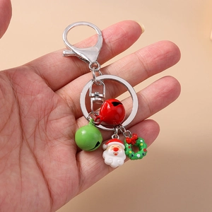 Detailed view of Christmas keychain with Santa Claus, mini wreath, and colorful bells