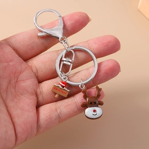 Detail of Christmas reindeer keychain with Merry Christmas plaque and metal lobster clasp