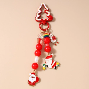 Détail du fermoir sapin de Noël avec pendentifs émaillés Père Noël et bonhomme de neige