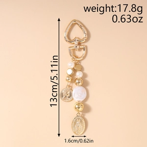 Detail showing dimensions of gold beaded keychain with faux pearls and coin pendants