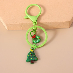 Detail of Christmas tree and wreath keychains with green metal carabiner clip