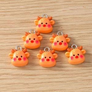 Detail view of 6 orange resin deer charms with metal loops for DIY holiday jewelry making