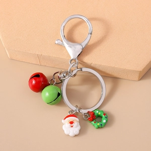 Detail of Christmas keychain with Santa Claus, wreath charms, and colorful festive bells