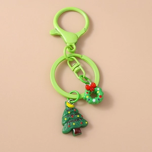 Detail of Christmas keychain with green lobster clasp, festive wreath and tree charms