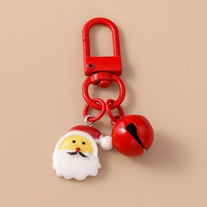 Detail of Christmas keychain with red lobster clasp, resin Santa Claus, and bell