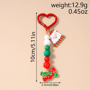 Detailed view of Christmas Santa keychain with red and green beads and metal charms